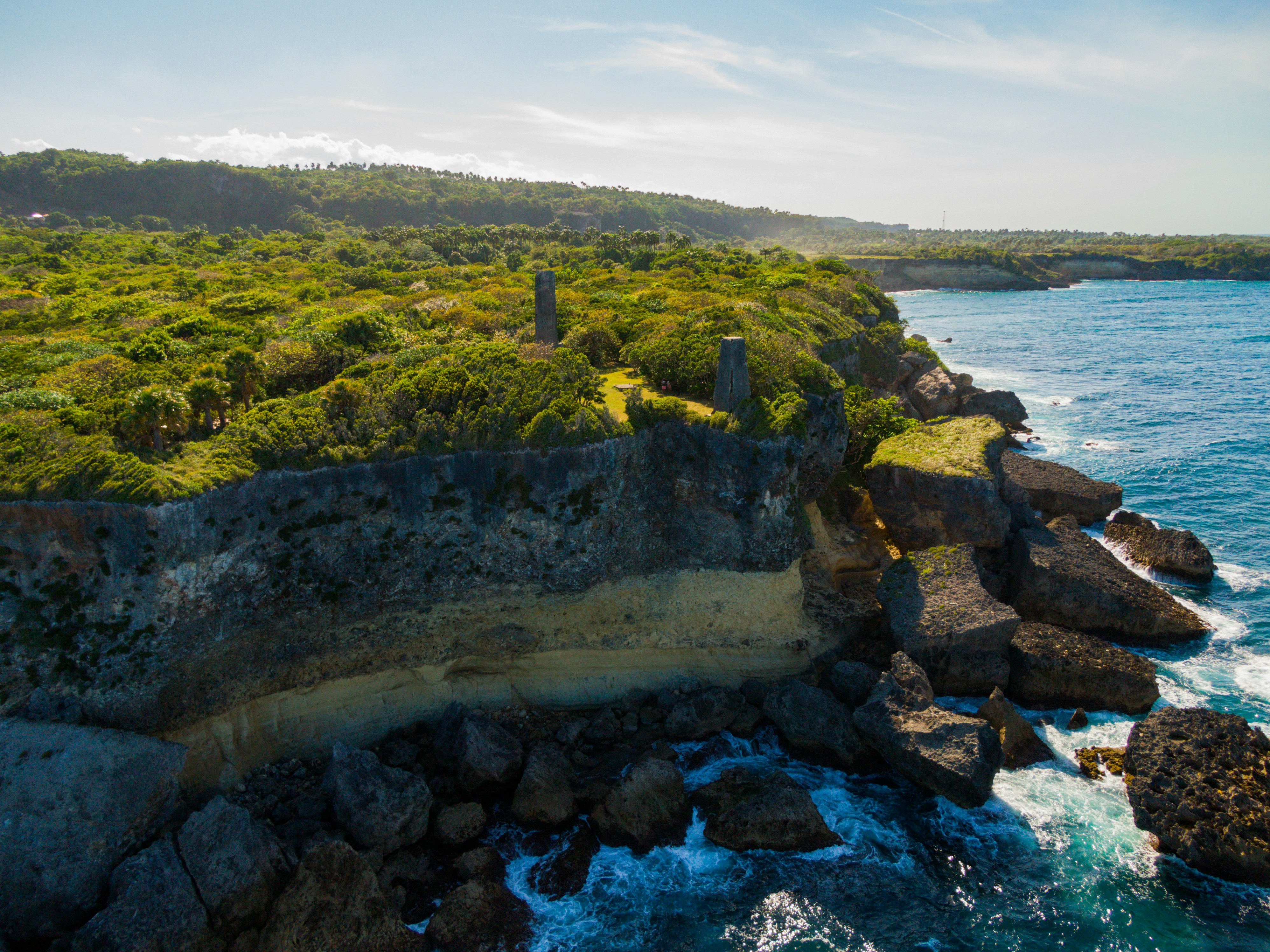 Rocky tropical coastline with cliffs and turquoise water